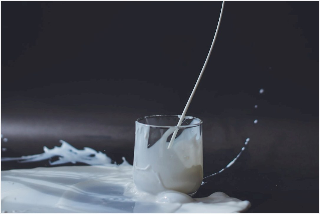 clear drinking glass with yellow liquid