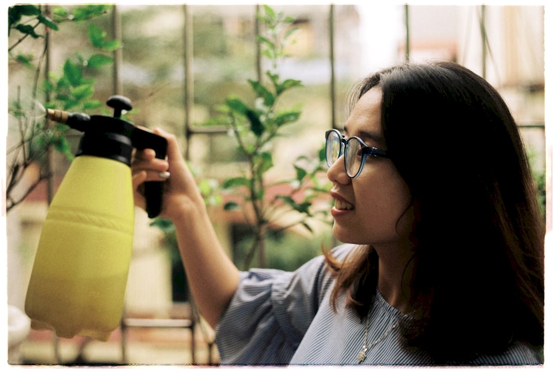 woman holding water sprayer
