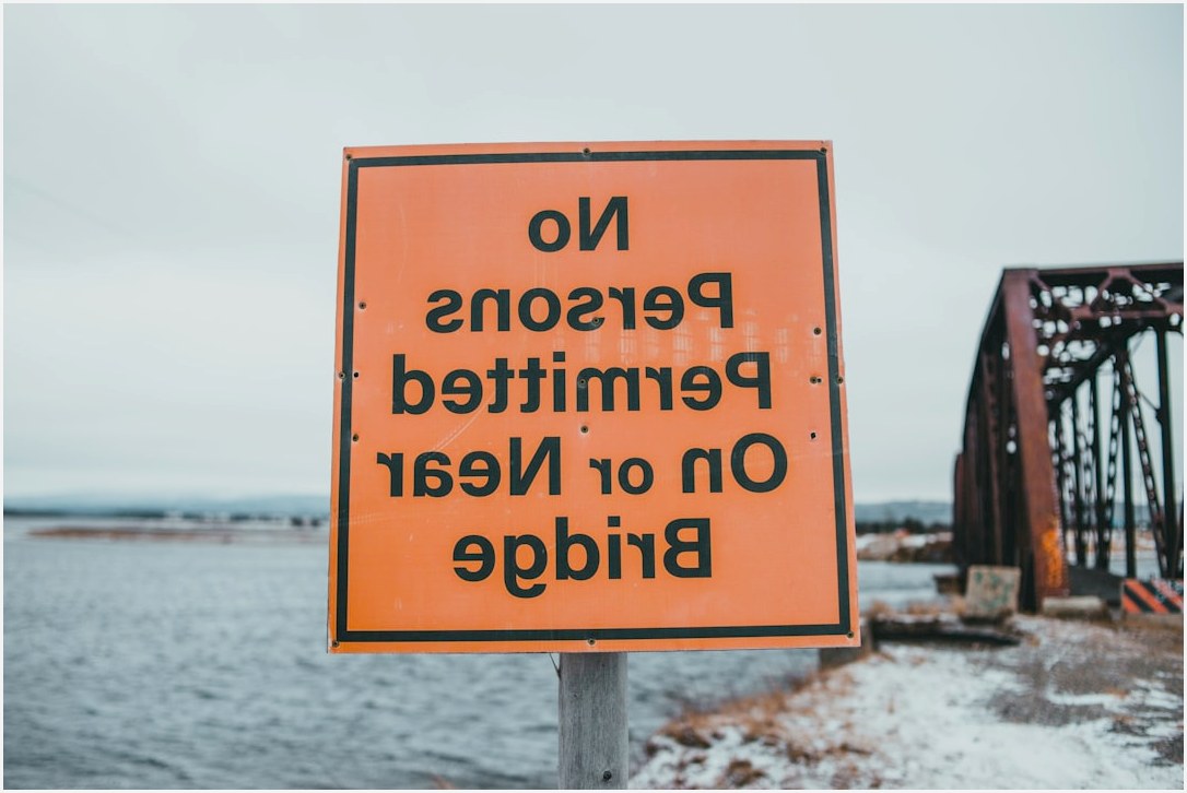 a no persons permitted on or near bridge sign