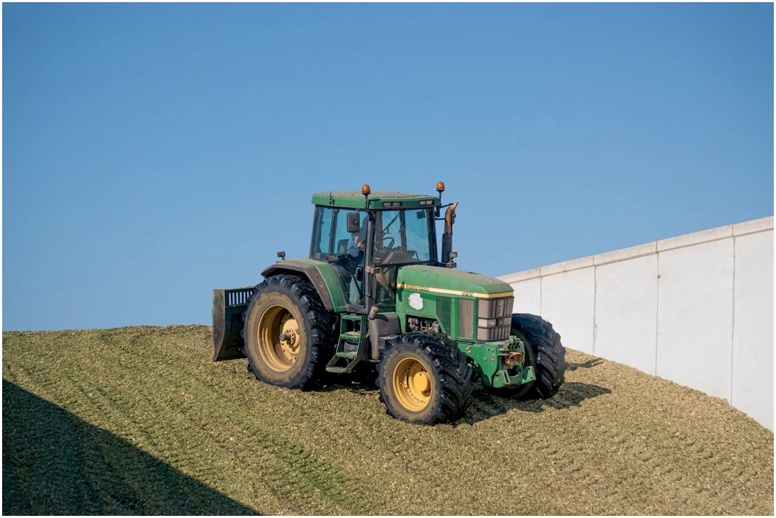 A tractor is parked on the side of a hill
