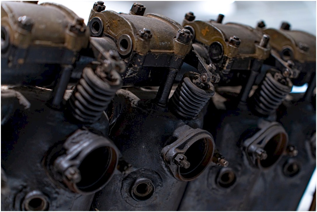 Old engine cylinder heads with springs.