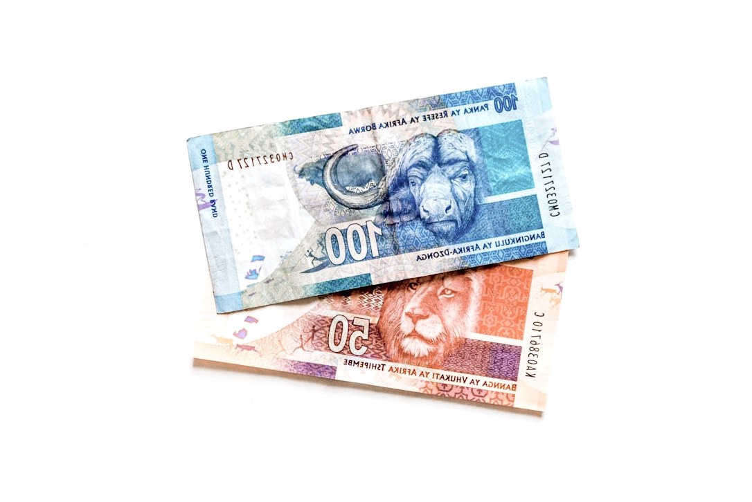 100 banknote on black surface